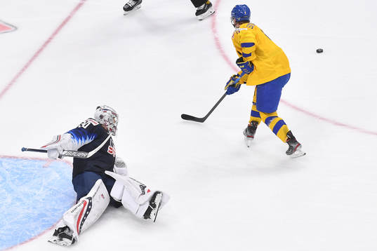 Victor Söderström of Sweden loses control of the puck