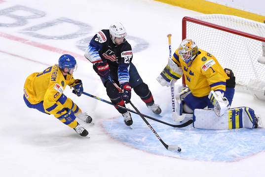 Landon Slaggert of USA skates the puck through the crease