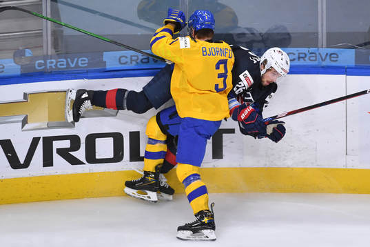 Tobias Björnfot of Sweden takes Landon Slaggert of USA