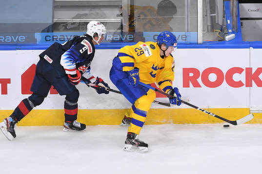 Trevor Zegras of USA pursues Albin Sundsvik of Sweden