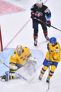 Jesper Wallstedt of Sweden makes a third period save