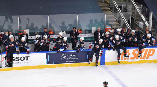 Team USA leaves the bench to celebrate their 4-0 win
