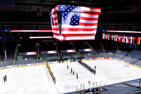Team USA and Team Sweden stand for the playing of the USA