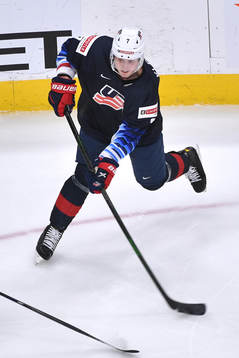 Tyler Kleven of USA shoots the puck
