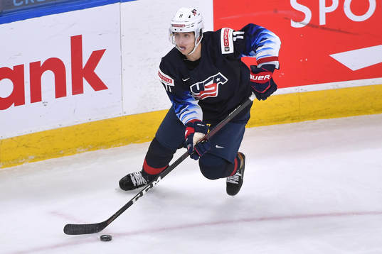 Brock Faber of USA skates with the puck