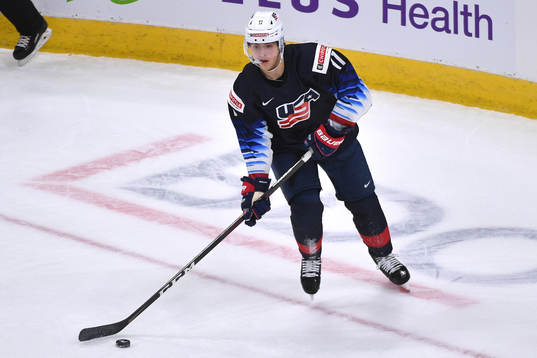 Brock Faber of USA skates with the puck