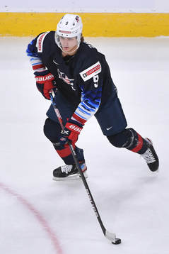 Trevor Zegras of USA skates with the puck