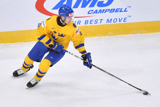 Oskar Kvist of Sweden skates with the puck
