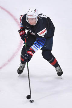 Cam York of USA skates with the puck