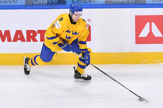 Oskar Kvist of Sweden skates with the puck