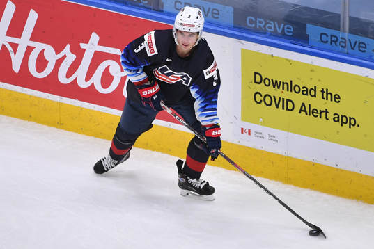 Henry Thrun of USA skates with the puck