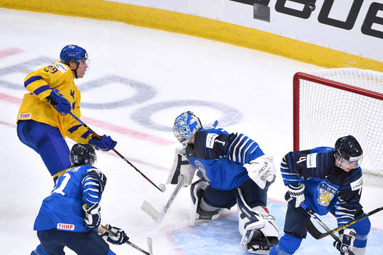 Albin Sundsvik of Sweden shoots the puck over the net late