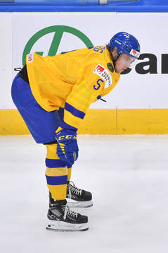 Philip Broberg of Sweden looks towards the opponents end ice
