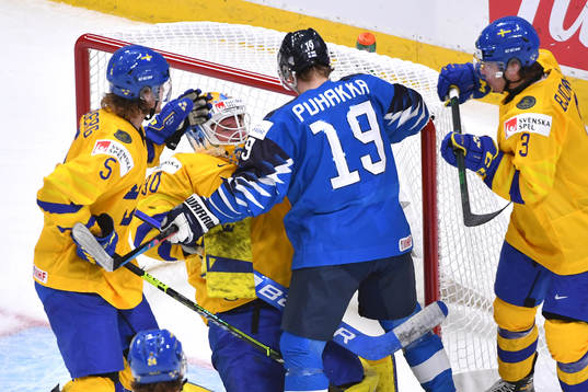 Petteri Puhakka of Finland collides with Hugo Alnefelt of