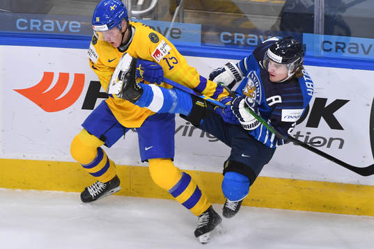 Santeri Hatakka of Finland collides with Simon Holmström