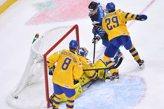 Roni Hirvonen of Finland scores the game winning goal