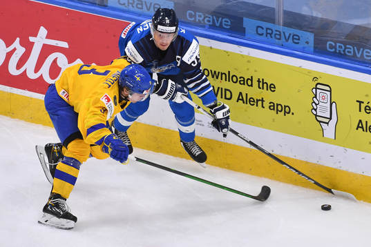 Tobias Björnfot of Sweden collides with Mikko Kokkonen of
