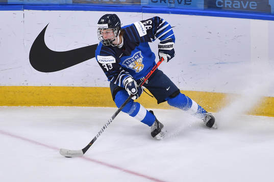 Brad Lambert of Finland stops with the puck