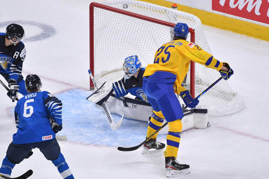 Elmer Söderblom of Sweden scores