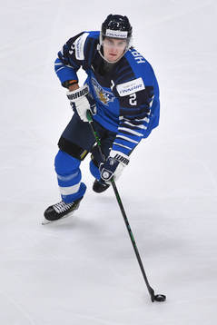 Santeri Hatakka of Finland skates with the puck