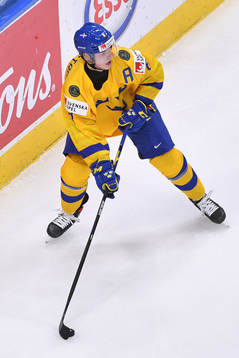 Victor Söderström of Sweden skates with the puck