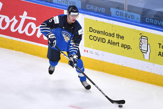 Eemil Viro of Finland skates with the puck