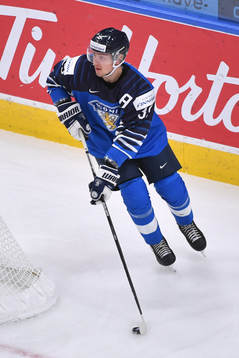 Mikko Kokkonen of Finland skates with the puck