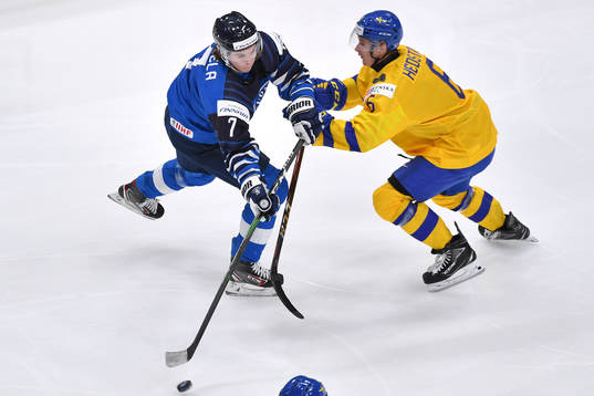 Ludvig Hedström of Sweden collides with Topi Niemela of