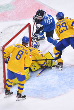 Roni Hirvonen of Finland scores the game winning goal