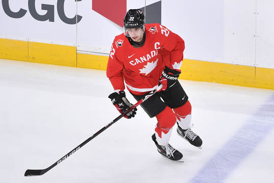 Dylan Cozens of Canada skates