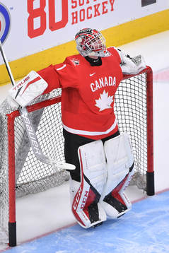 Devon Levi of Canada participates in warm up