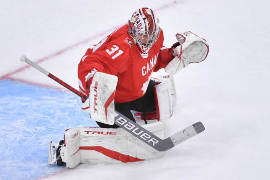 Dylan Garand of Canada participates in warm up