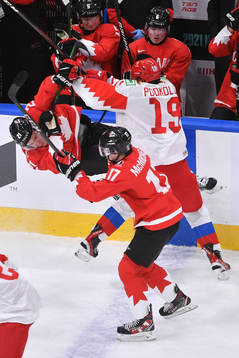 Vasili Podkolzin of Russia hits Kaiden Guhle of Canada
