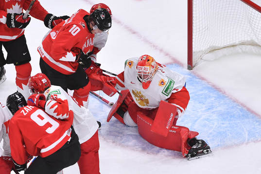 Yaroslav Askarov of Russia makes a save as Dylan Holloway