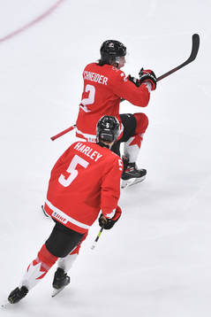 Braden Schneider of Canada celebrates the 4-0 goal with