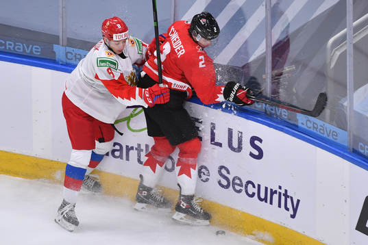 Arseni Gritsyuk of Russia collides with Braden Schneider of