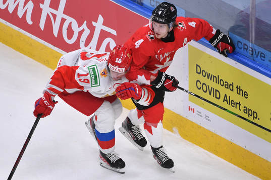 Vasili Podkolzin of Russia collides with Bowen Byram of