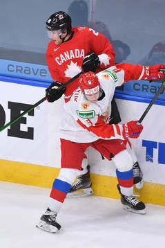 Arseni Gritsyuk of Russia collides with Dawson Mercer of