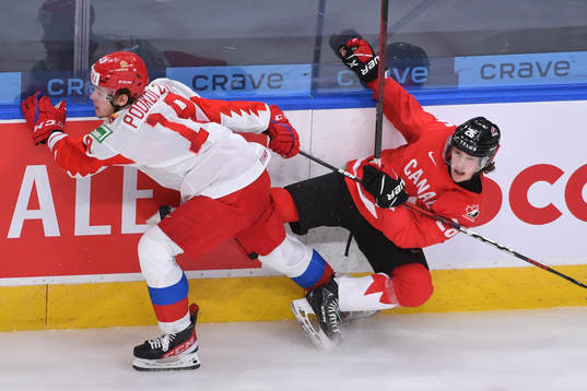 Vasili Podkolzin of Russia collides with Philip Tomasino of