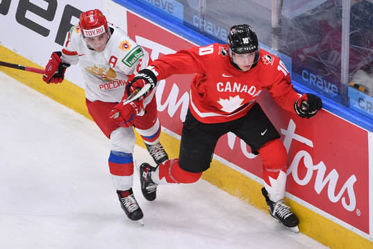 Semyon Chistyakov of Russia collides with Dylan Holloway of