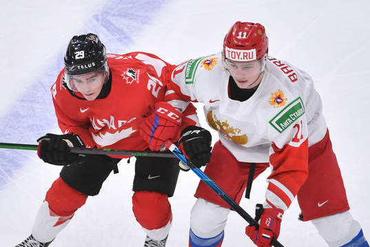 Jack Quinn of Canada battles for position off the face off
