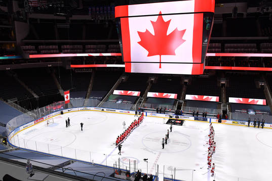 Team Canada and Team Russia stand for the playing of Oh