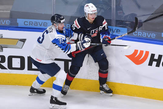 Mikko Kokkonen of Finland collides with Alex Turcotte of USA