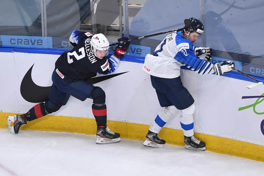 Drew Helleson of USA collides with Mikael Pyyhtia of Finland