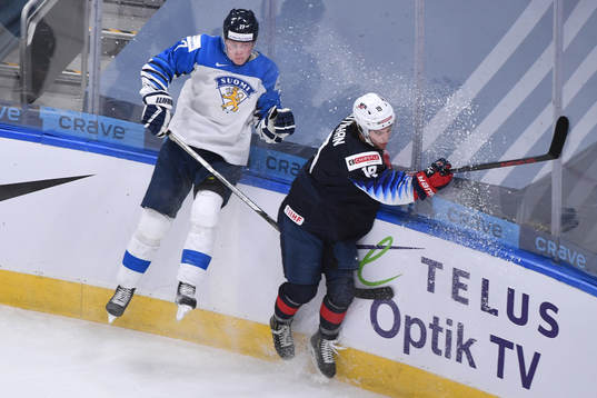 Juuso Parssinen of Finland collides with Patrick Moynihan