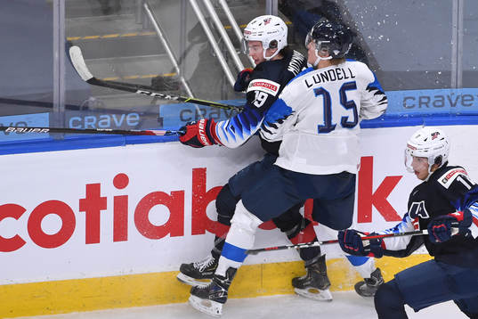 Anton Lundell of Finland collides with Patrick Moynihan of