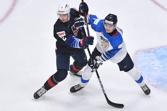 Matthew Boldy of USA and Ville Heinola of Finland battle