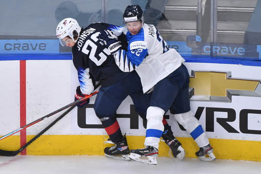 Roni Hirvonen of Finland collides with Ryan Johnson of USA