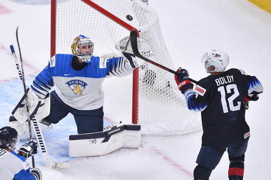 Kari Piiroinen of Finland and Matthew Boldy of USA reach