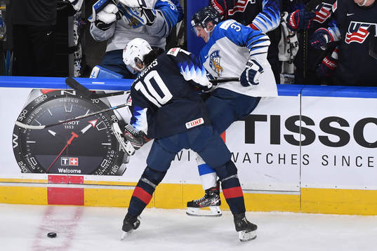 Matthew Beniers of USA and Aku Raty of Finland collide